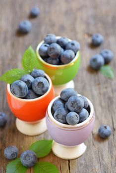 Freshly picked blueberries on wooden table