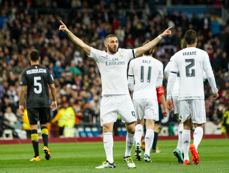 SPAIN, Madrid: Real Madrid's French Karim Benzema celebrates scoring during Spanish Liga football match Real Madrid vs Sevilla at Santiago Bernabeu stadium in Madrid on March 20, 2016.