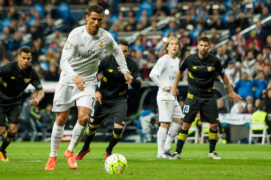SPAIN, Madrid: Real Madrid's Portuguese forward Cristiano Ronaldo in action during the Spanish league football match Real Madrid CF vs Sevilla FC at the Santiago Bernabeu stadium in Madrid on March 20, 2016. 