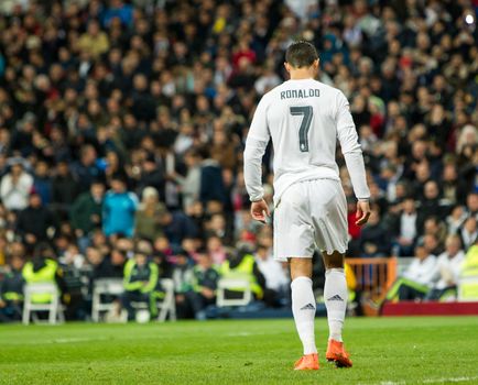 SPAIN, Madrid: Real Madrid's Portuguese forward Cristiano Ronaldo in action during the Spanish league football match Real Madrid CF vs Sevilla FC at the Santiago Bernabeu stadium in Madrid on March 20, 2016. 