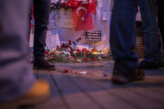 TURKEY, Istanbul: People gather at the site of a blast on Istiklal Street, a major shopping and tourist district, in central Istanbul on March 20, 2016, to pay tribute to four people killed during a suicide blast that ripped through Istanbul less than a week after another deadly attack left 35 dead in Ankara.