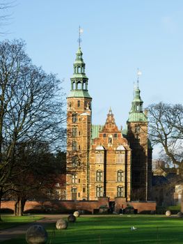 Rosenberg Castle and Stone Balls Alley with Green Grass Early Morning. Copenhagen, Denmark