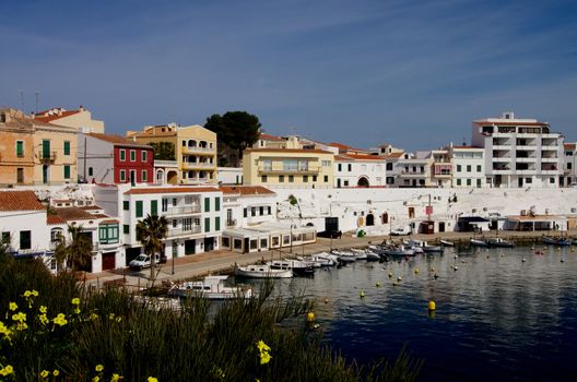 Es Castell Harbor, Seafront  and Lagoon on Blue Skies background, Menorca, Balearic Islands