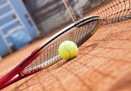 tennis background with tennis equipment on clay course