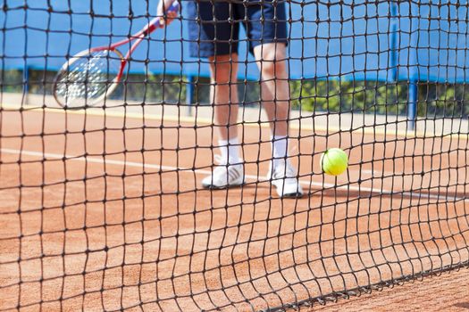 tennis background with tennis equipment on clay course