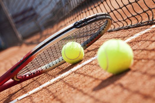 tennis background with tennis equipment on clay course