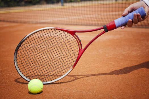 tennis background with tennis equipment on clay course