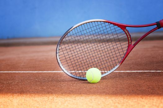 tennis background with tennis equipment on clay course