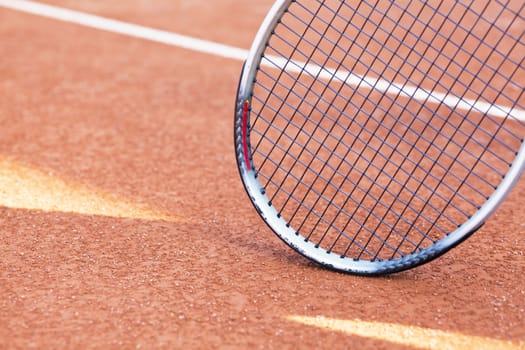 tennis background with tennis equipment on clay course