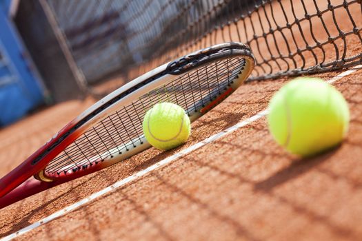 tennis background with tennis equipment on clay course