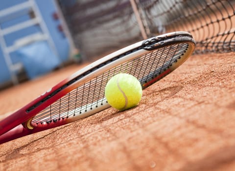 tennis background with tennis equipment on clay course