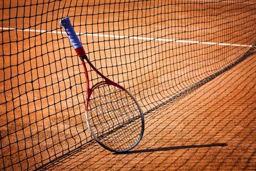 tennis background with tennis equipment on clay course