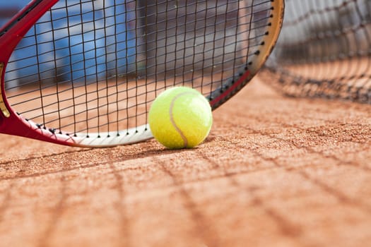 tennis background with tennis equipment on clay course