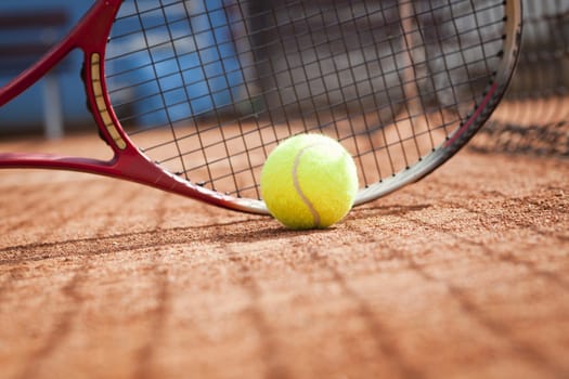 tennis background with tennis equipment on clay course