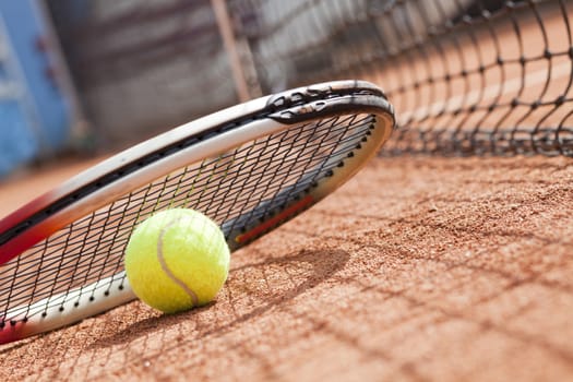 tennis background with tennis equipment on clay course