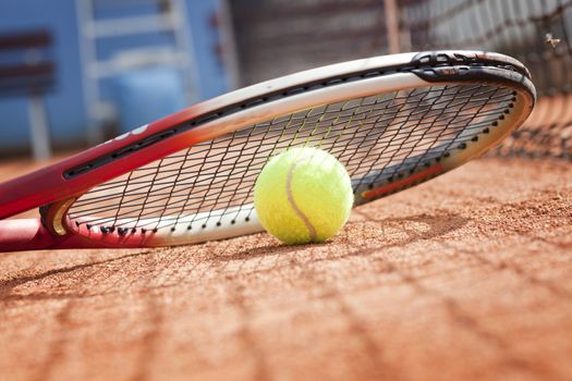 tennis background with tennis equipment on clay course