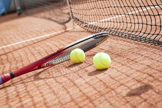 tennis background with tennis equipment on clay course