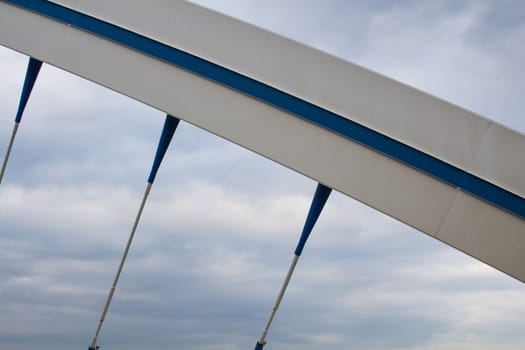 Apollo bridge in Bratislava, Slovakia, uniting banks of river Danube. Details of the construction. Intense clouds on the sky.