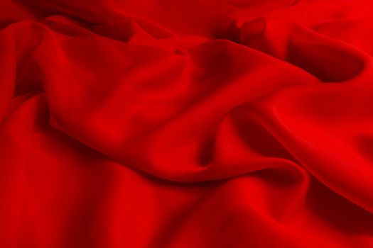 the texture of the red fabric from the delicate chiffon