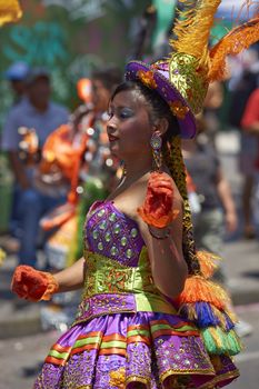 Morenada dancers in traditional Andean costume performing at the annual Carnaval Andino con la Fuerza del Sol in Arica, Chile.