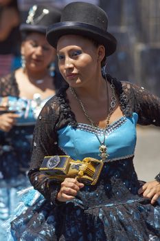 Morenada dancer in traditional Andean costume performing at the annual Carnaval Andino con la Fuerza del Sol in Arica, Chile.