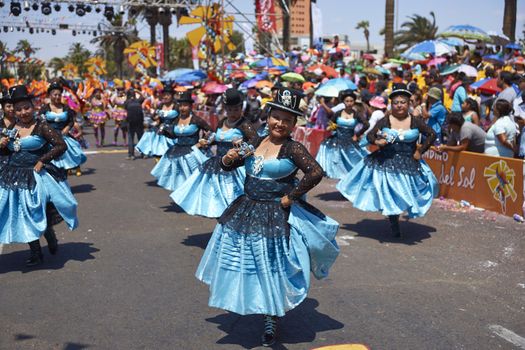 Morenada dancers in traditional Andean costume performing at the annual Carnaval Andino con la Fuerza del Sol in Arica, Chile.