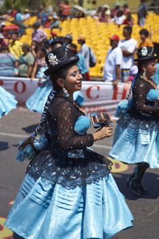 Morenada dancers in traditional Andean costume performing at the annual Carnaval Andino con la Fuerza del Sol in Arica, Chile.