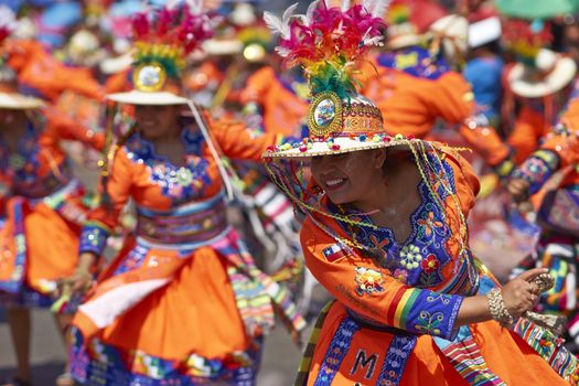 Tinku dancing group in colourful costumes performing a traditional ritual dance as part of the Carnaval Andino con la Fuerza del Sol in Arica, Chile.