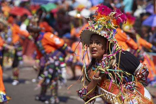 Tinku dancing group in colourful costumes performing a traditional ritual dance as part of the Carnaval Andino con la Fuerza del Sol in Arica, Chile.