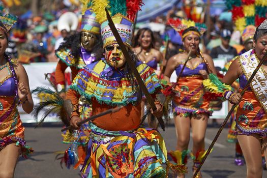 Tobas dance group in traditional Andean costumes performing at the annual Carnaval Andino con la Fuerza del Sol in Arica, Chile.