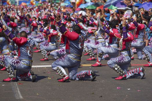 Caporales dancers in traditional Andean costume performing at the annual Carnaval Andino con la Fuerza del Sol in Arica, Chile.