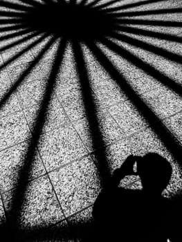 shadow on the tile floor in black and white