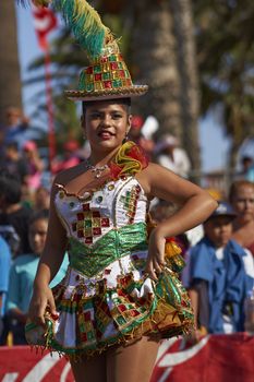 Morenada dancers in traditional Andean costume performing at the annual Carnaval Andino con la Fuerza del Sol in Arica, Chile.