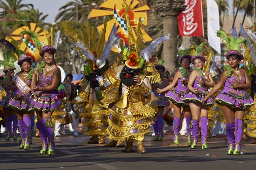 Morenada dancers in traditional Andean costume performing at the annual Carnaval Andino con la Fuerza del Sol in Arica, Chile.