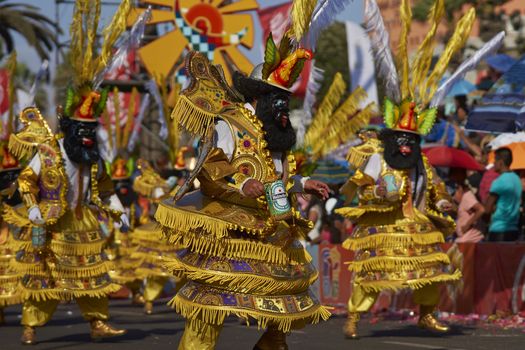 Morenada dancers in traditional Andean costume performing at the annual Carnaval Andino con la Fuerza del Sol in Arica, Chile.