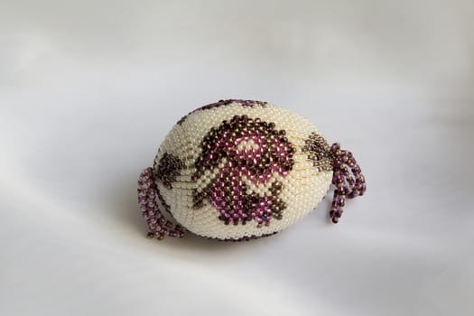 souvenir egg on delicate White silk background