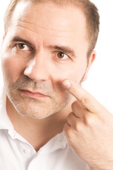 Close-up of mature man applying face cream France