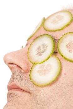 Close-up of mature man with face pack cucumber France