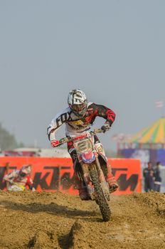 SUPHANBURI - MARCH 06 : Gautier Paulin #21 with Honda Motorcycle in competes during the FIM MXGP Motocross Wolrd Championship Grand Prix of Thailand 2016 on March 06, 2016 in Suphanburi, Thailand.