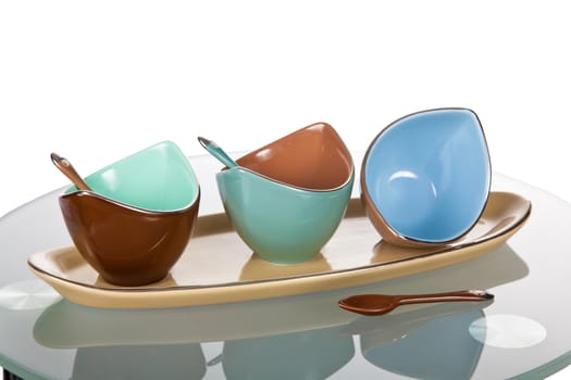 Three colorful ceramic sauce boats