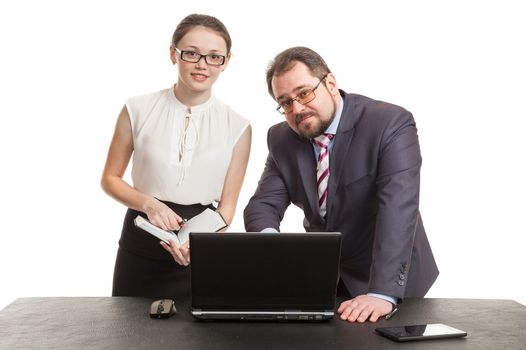 partners conduct negotiations facing a table and look at the laptop