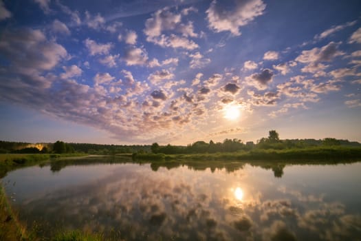 night reflection. WArm summer night with a moon in Belarus