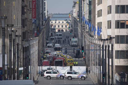BELGIUM, Brussels : Police and emergency vehicles are pictured near Maelbeek metro station in Brussels, which has been evacuated after an explosion on March 22, 2016. Brussels' public transport company STIB-MIVB has confirmed injuries, although no deaths have been reported. Earlier this morning at least 13 people have been killed after two explosions occurred in the departure hall of Brussels Airport in Zaventem. Government sources speak of a terrorist attack. The terrorist threat level has been heightened to four across the country.