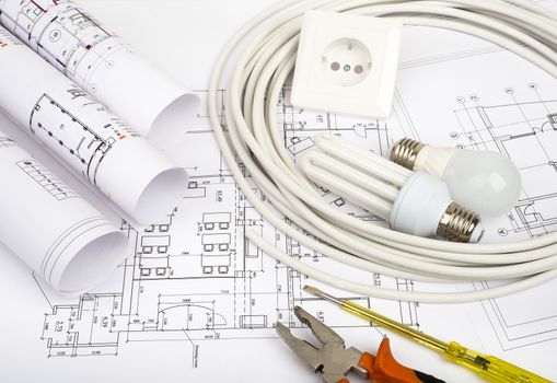 Architecture plan and rolls of blueprints with socket. Building concept