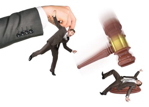 Inscribed gavel hitting scared businessman isolated on white background. Justice concept
