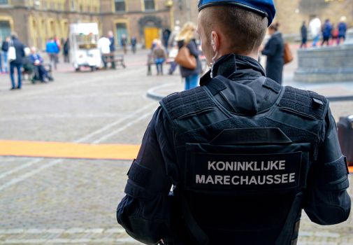 NETHERLANDS, the Hague: A member of the Royal Military Police stands by as the Hague, the Netherlands is on high alert following the deadly attacks in Brussels, Belgium on March 22, 2016. The attacks, at least one of which was carried out by a suicide bomber, left at least 30 dead at Zaventem airport and Maelbeek metro station.