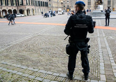 NETHERLANDS, the Hague: A member of the Royal Military Police stands by as the Hague, the Netherlands is on high alert following the deadly attacks in Brussels, Belgium on March 22, 2016. The attacks, at least one of which was carried out by a suicide bomber, left at least 30 dead at Zaventem airport and Maelbeek metro station.