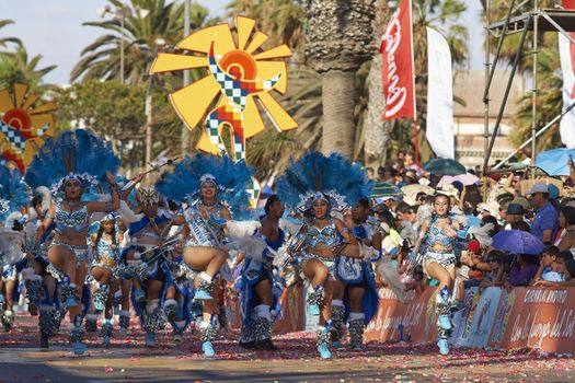Tobas dancers in traditional Andean costumes performing at the annual Carnaval Andino con la Fuerza del Sol in Arica, Chile.