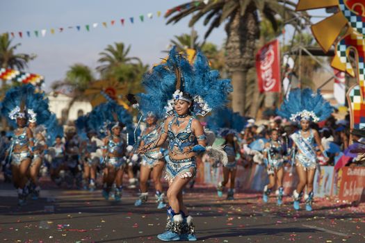 Tobas dancers in traditional Andean costumes performing at the annual Carnaval Andino con la Fuerza del Sol in Arica, Chile.