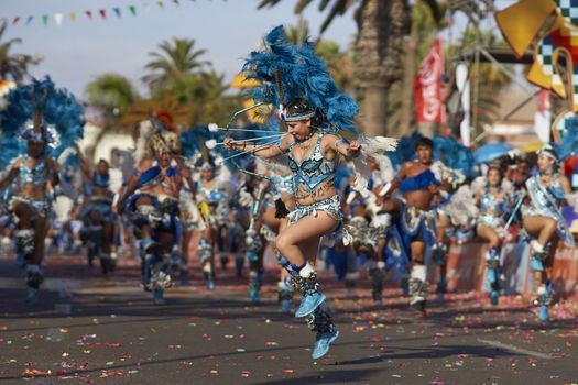 Tobas dancers in traditional Andean costumes performing at the annual Carnaval Andino con la Fuerza del Sol in Arica, Chile.